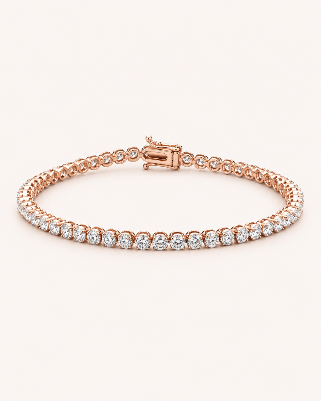 Crown-set lab-grown diamond tennis bracelet in rose gold on soft cream background