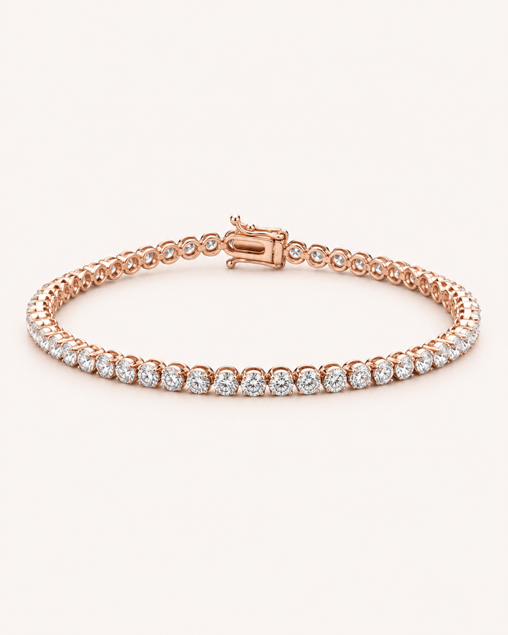 Crown-set lab-grown diamond tennis bracelet in rose gold on soft cream background