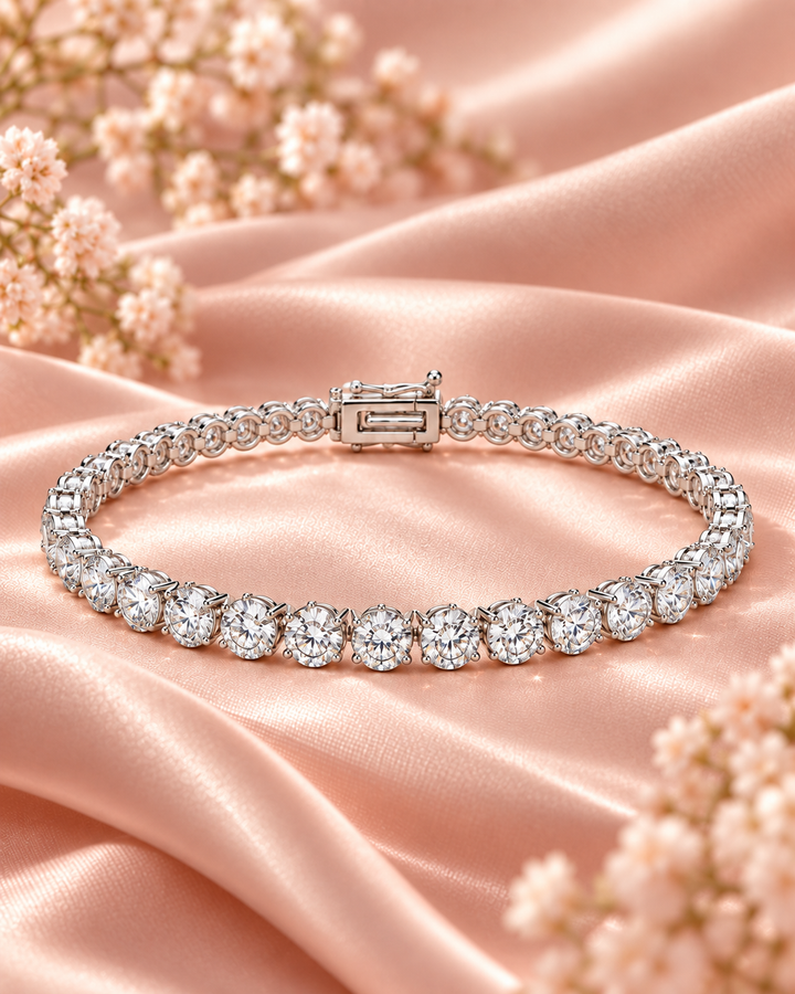 Lab-grown diamond three-prong tennis bracelet on soft blush satin