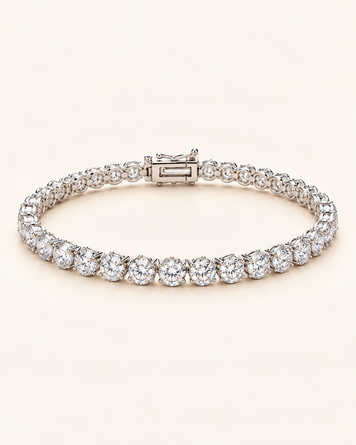 Lab-grown diamond three-prong tennis bracelet on cream background