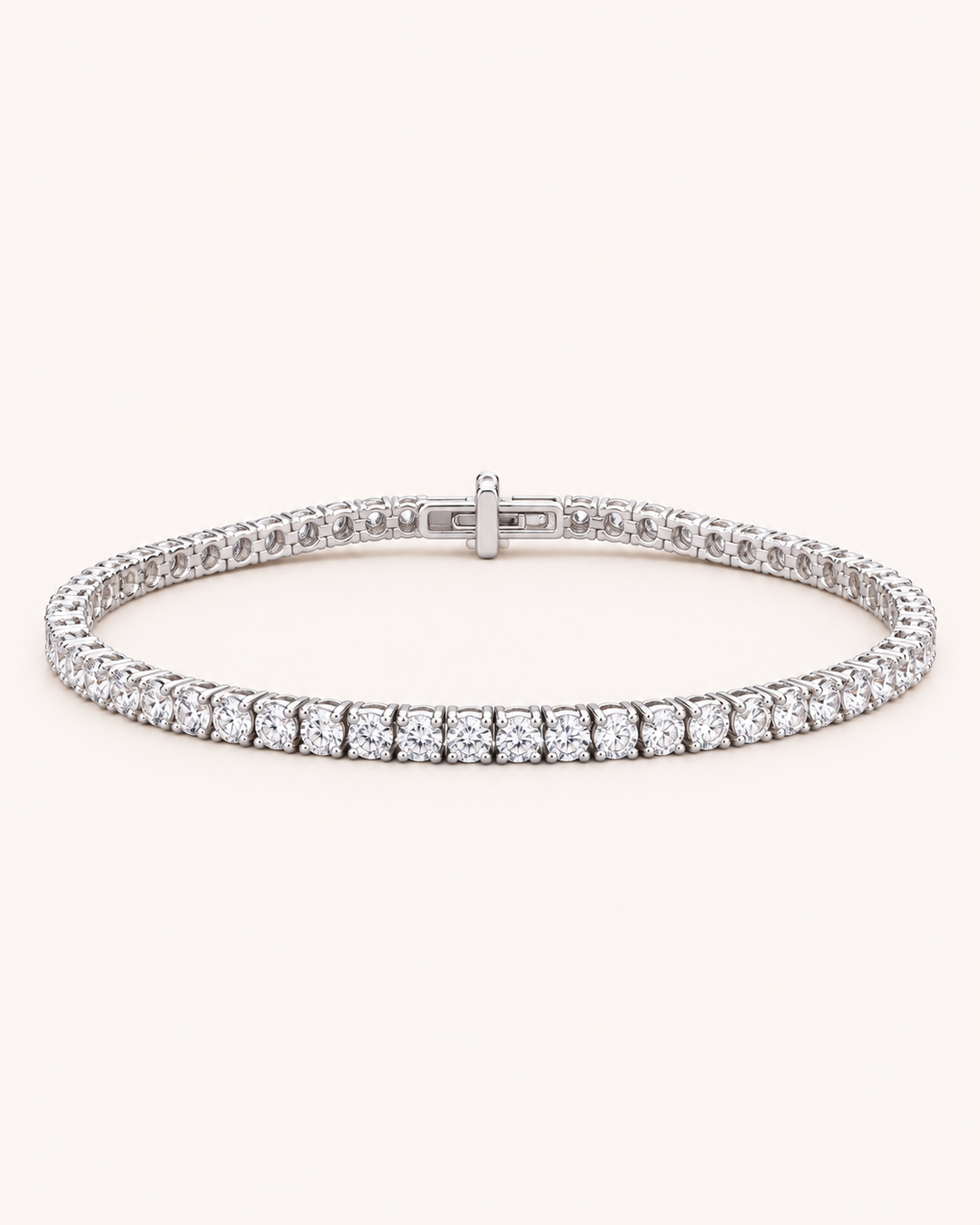 Under-lock lab-grown diamond tennis bracelet on soft ivory background