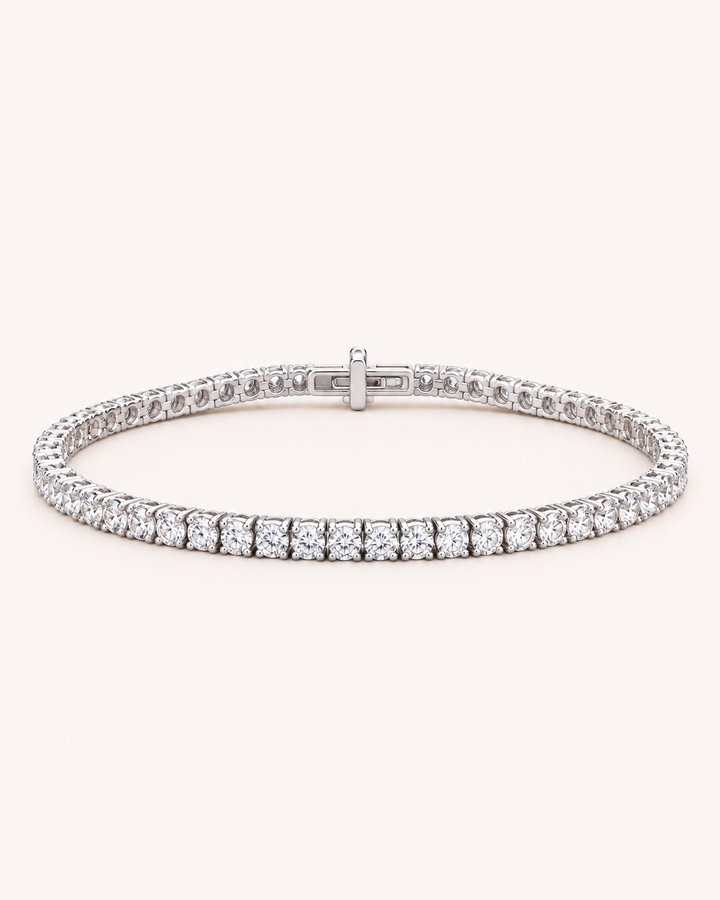 Under-lock lab-grown diamond tennis bracelet on soft ivory background